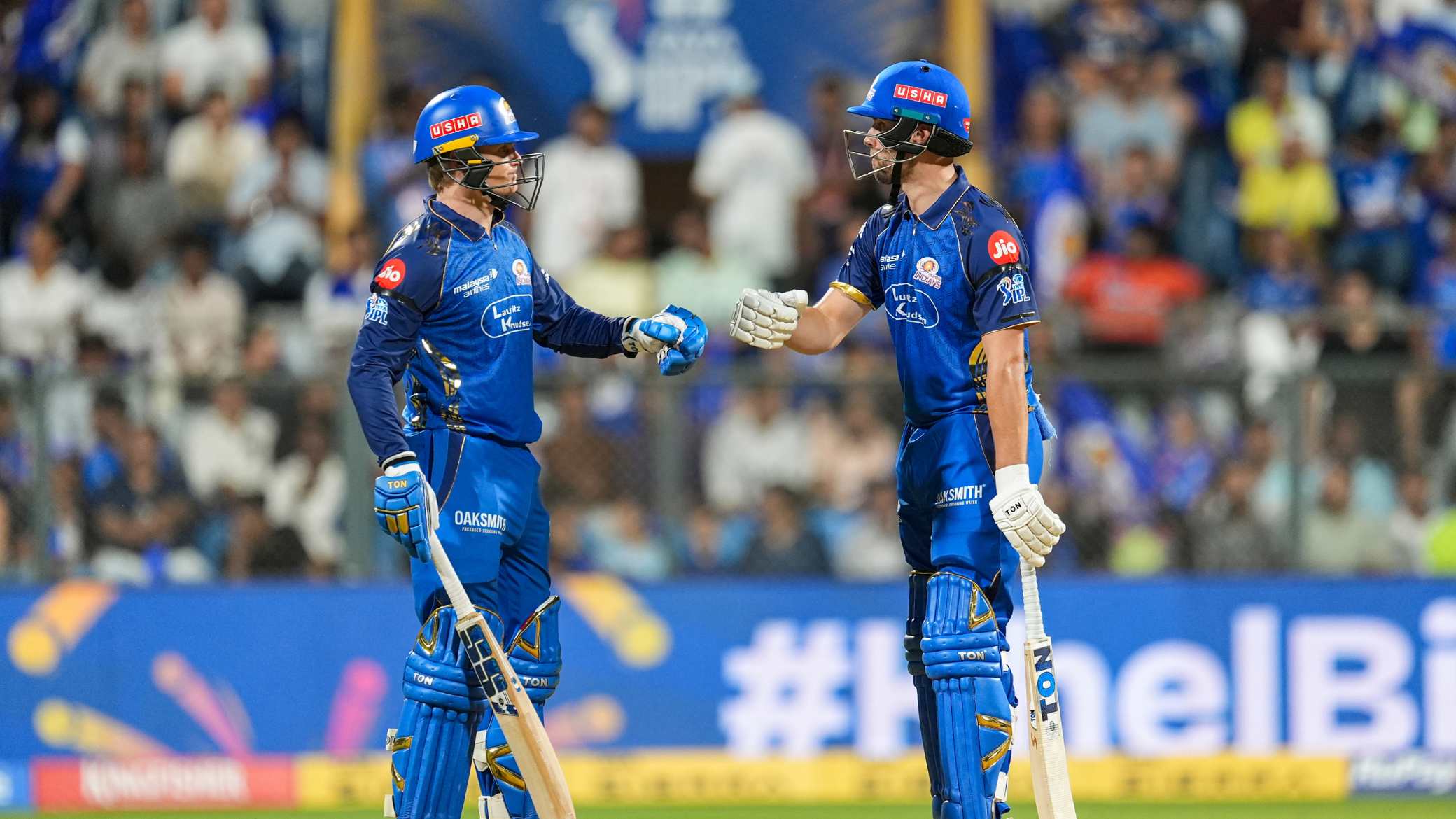 Mumbai Indians players walked out with black armbands